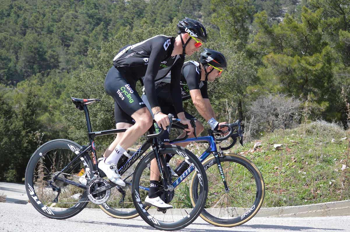 pro cyclists training on a climb in rhodes eurocyclingtrips